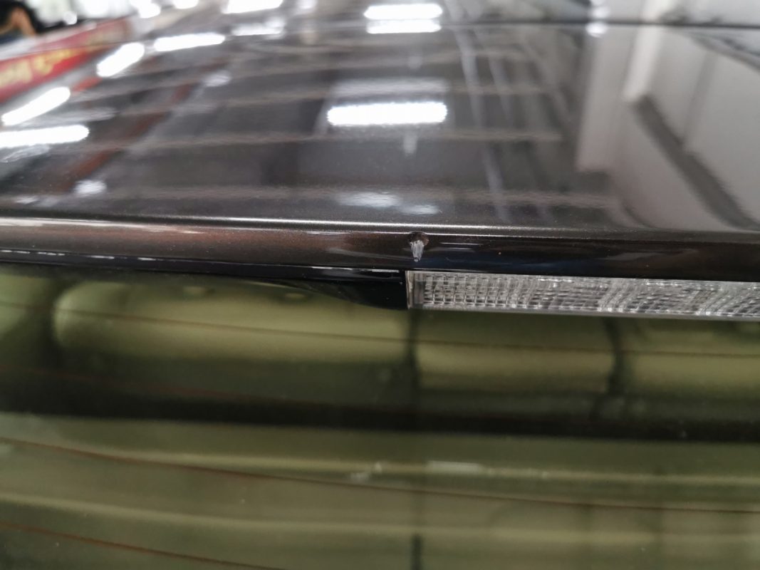 The RX350's resprayed paintwork showing clean reflections.