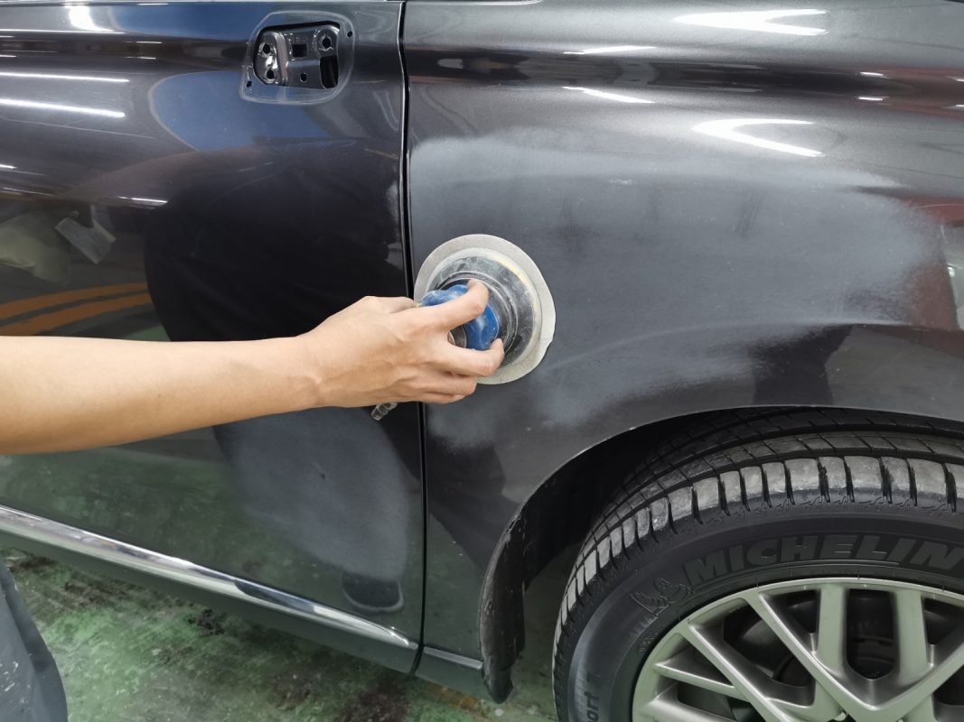 The Lexus RX350 at intake before the respray, with the surface being examined.