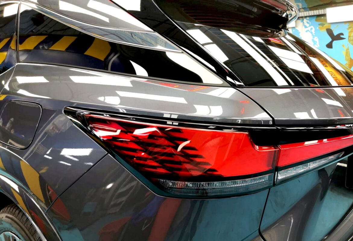 Rear quarter of the Lexus RX350h, glossy and protected.