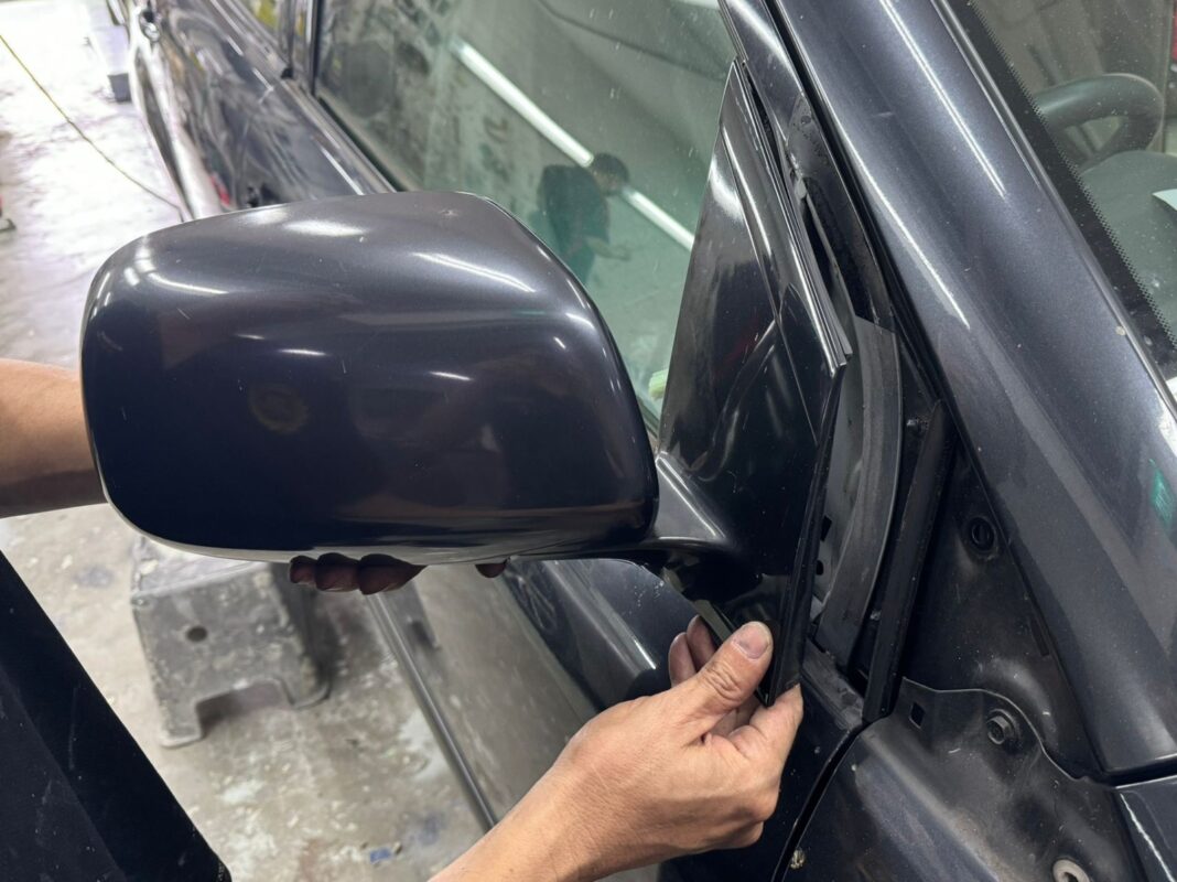 The Lexus RX400h further stripped down, panels exposed for bodywork.