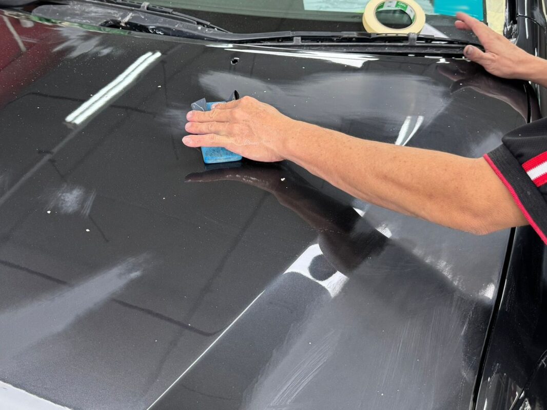 The Lexus RX400h receiving its new coat in the spray booth.