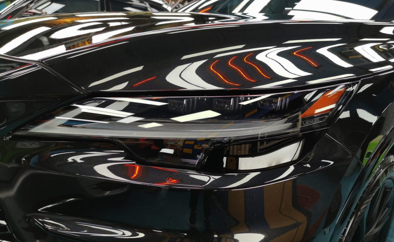 The RX500h's coated paintwork showing clean reflections.
