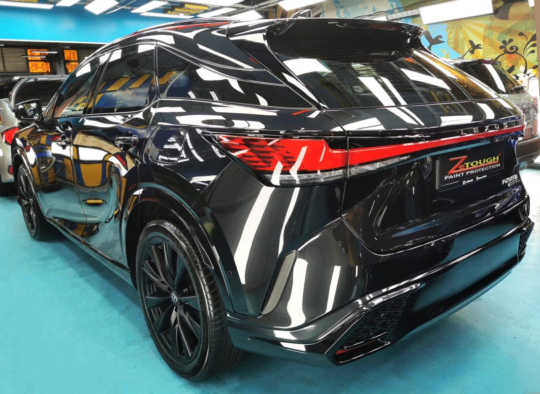 Rear quarter of the Lexus RX500h, glossy and protected.