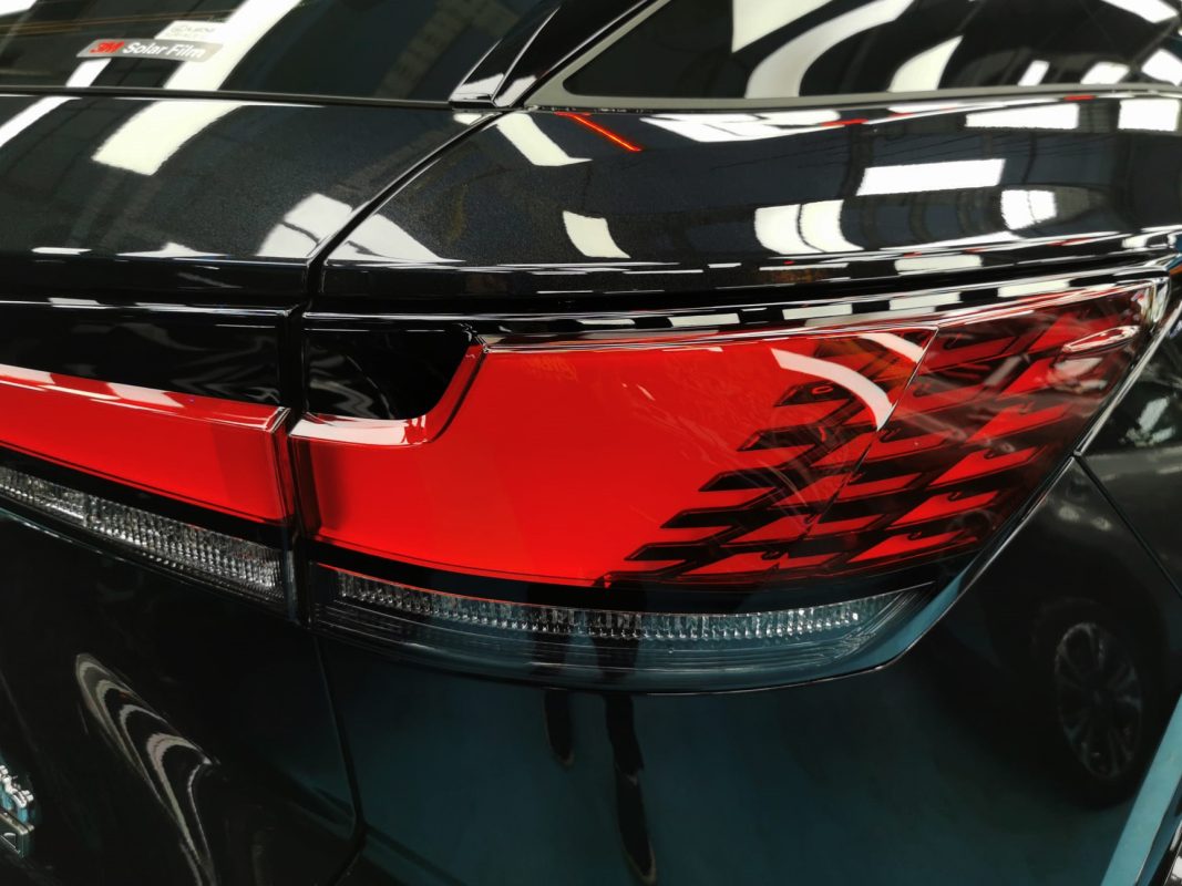 The coated bonnet of the Lexus RX500h under workshop lighting.