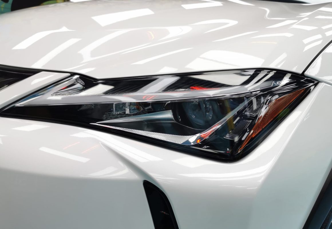 The UX250h's coated paintwork showing clean reflections.