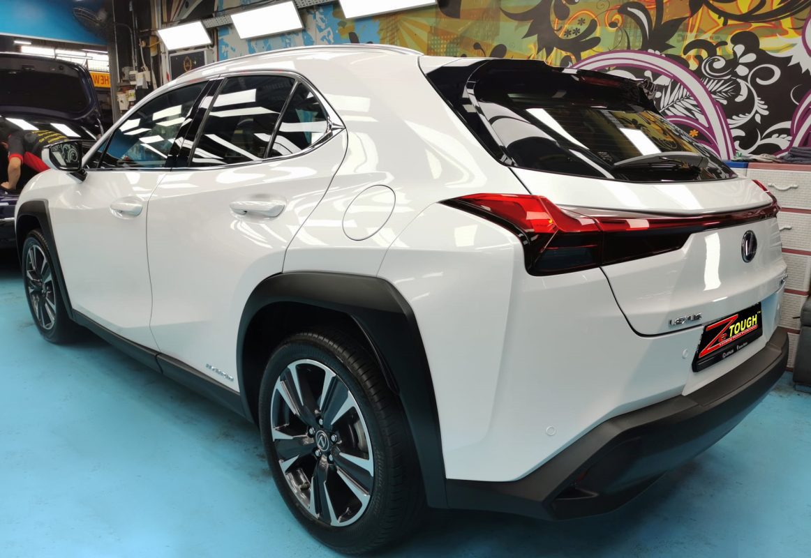 Rear quarter of the Lexus UX250h, glossy and protected.