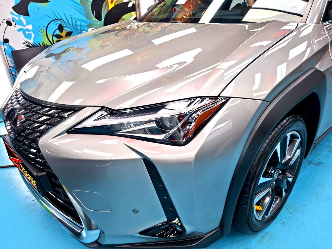 The Lexus UX250h's coated paintwork under workshop lighting.
