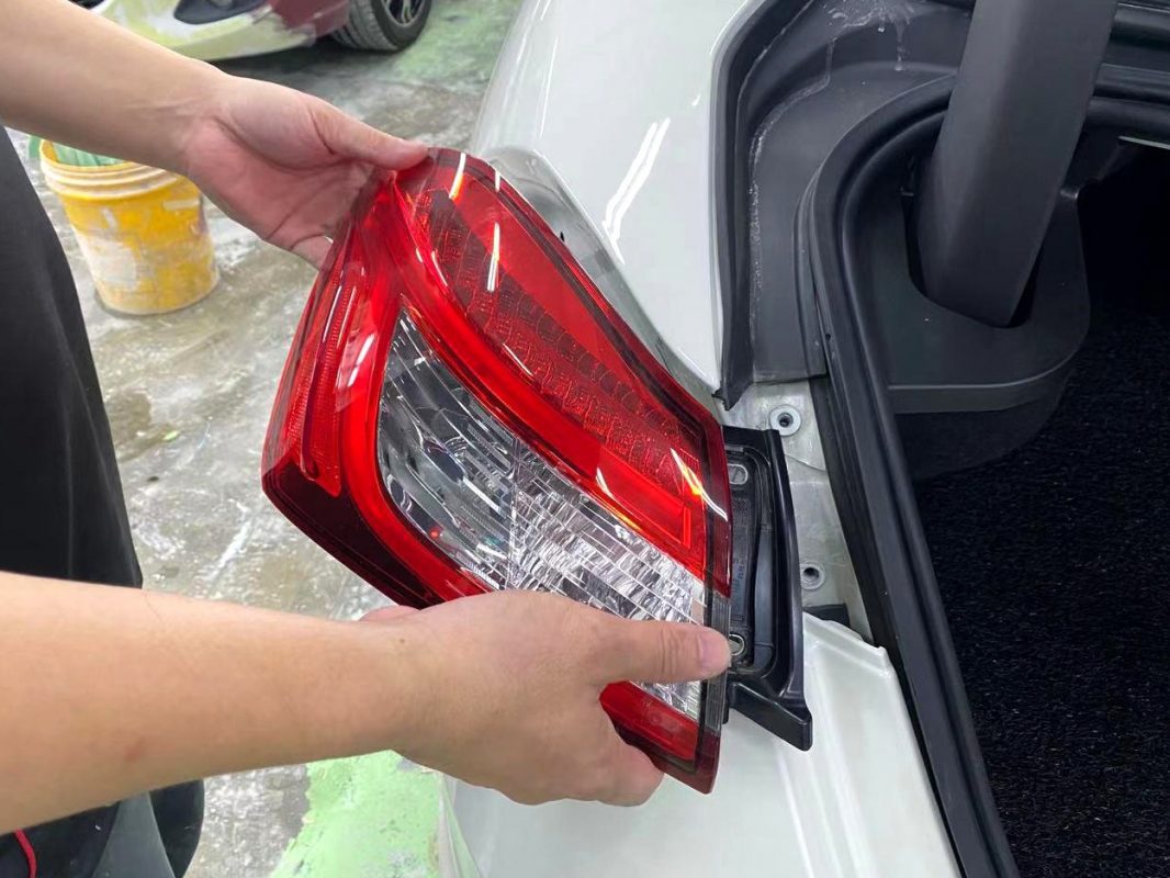 Polishing the new paint on the Ghibli to bring up the shine.