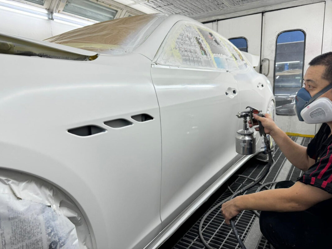 The new coat being applied to the Maserati Ghibli in the spray booth.