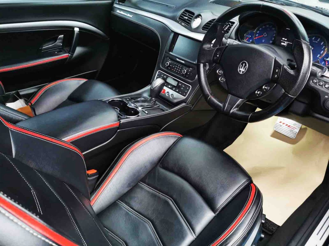 The Maserati GranTurismo parked in the workshop, freshly coated.