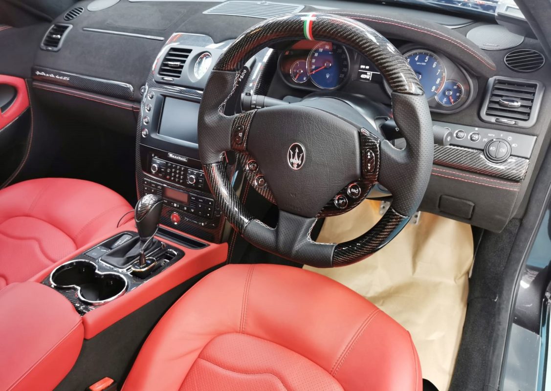 The Maserati Quattroporte parked in the workshop, freshly coated.