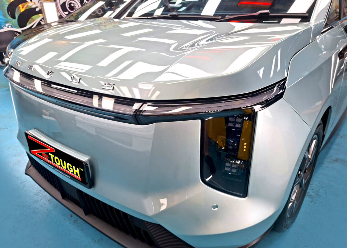 The Maxus Mifa 7's coated paintwork under workshop lighting.