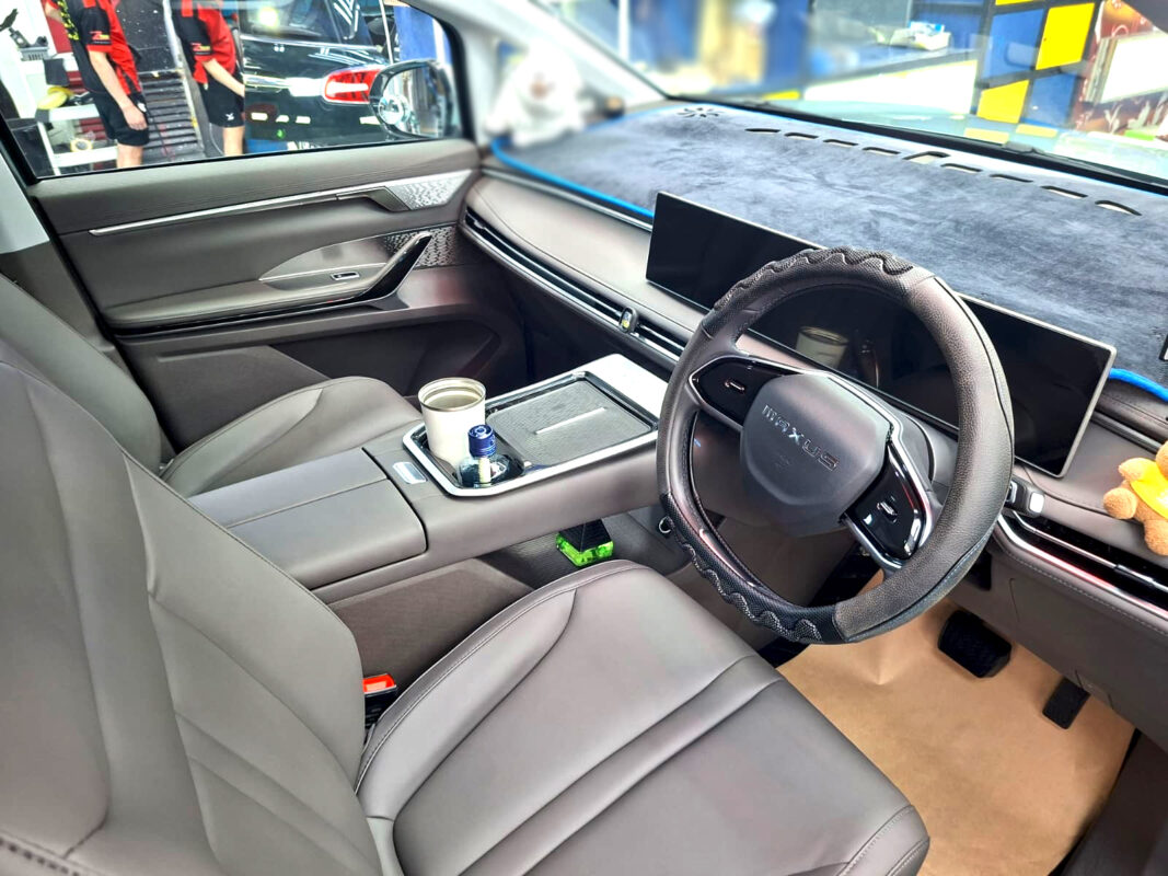 Reflections across the coated panels of the Maxus Mifa 7.