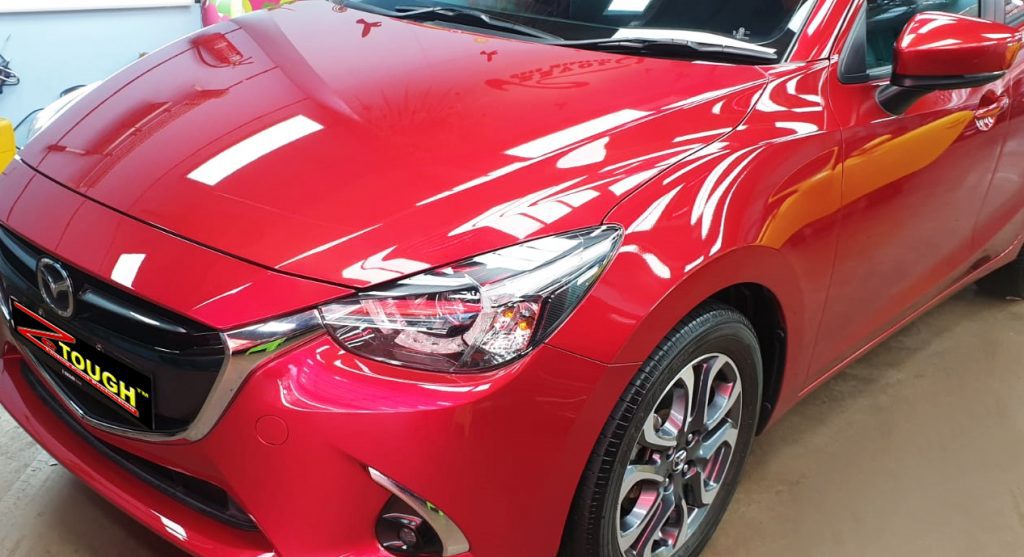 The Mazda 2 from a side angle after the ceramic coating.