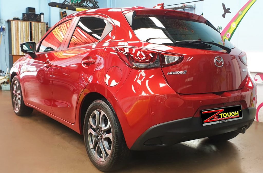 Rear quarter of the Mazda 2, glossy and protected.