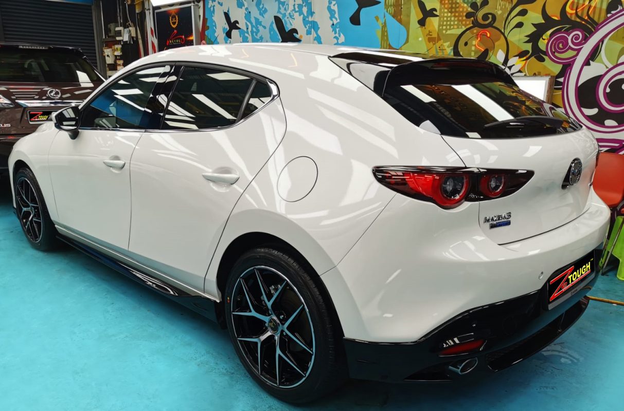 Rear quarter of the Mazda 3, glossy and protected.