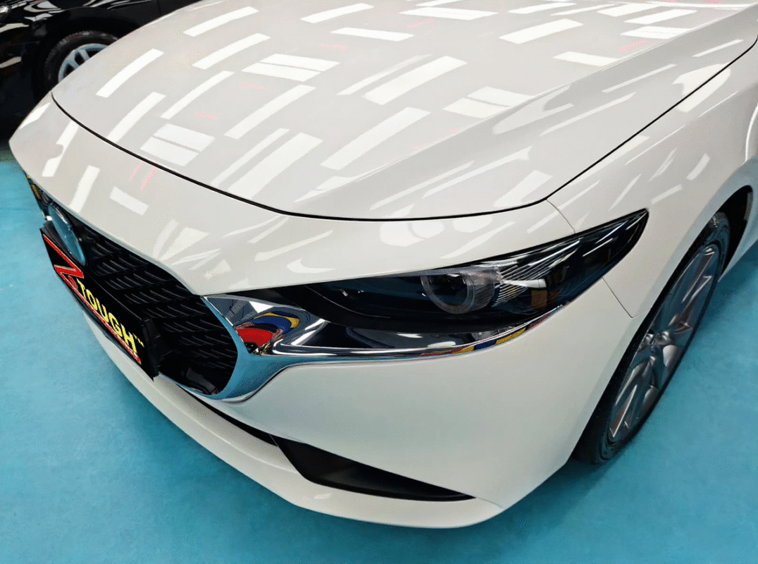 The Mazda 3 from a side angle after the ceramic coating.