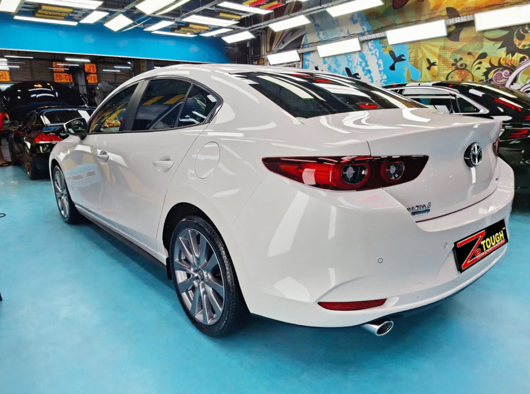 Rear quarter of the Mazda 3, glossy and protected.