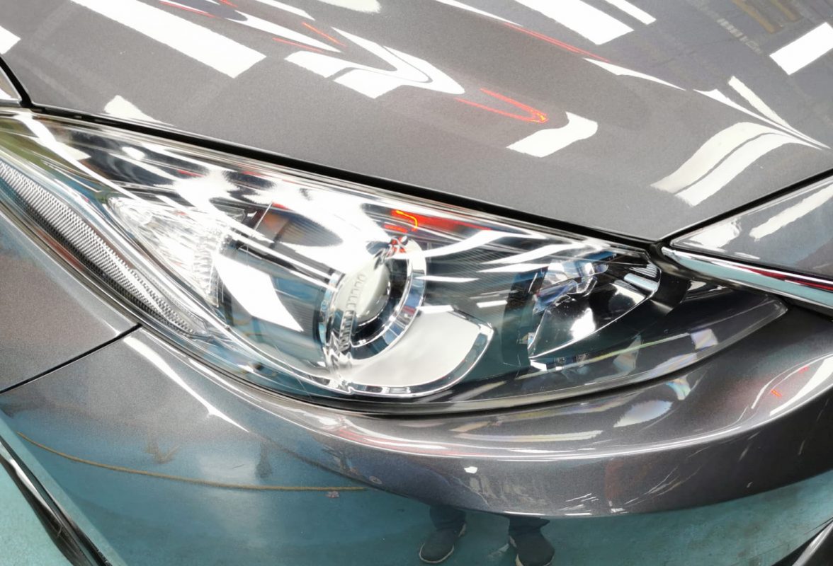 The Mazda 3's coated paintwork showing clean reflections.