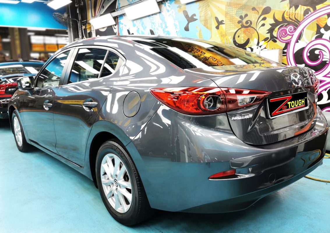 Rear quarter of the Mazda 3, glossy and protected.