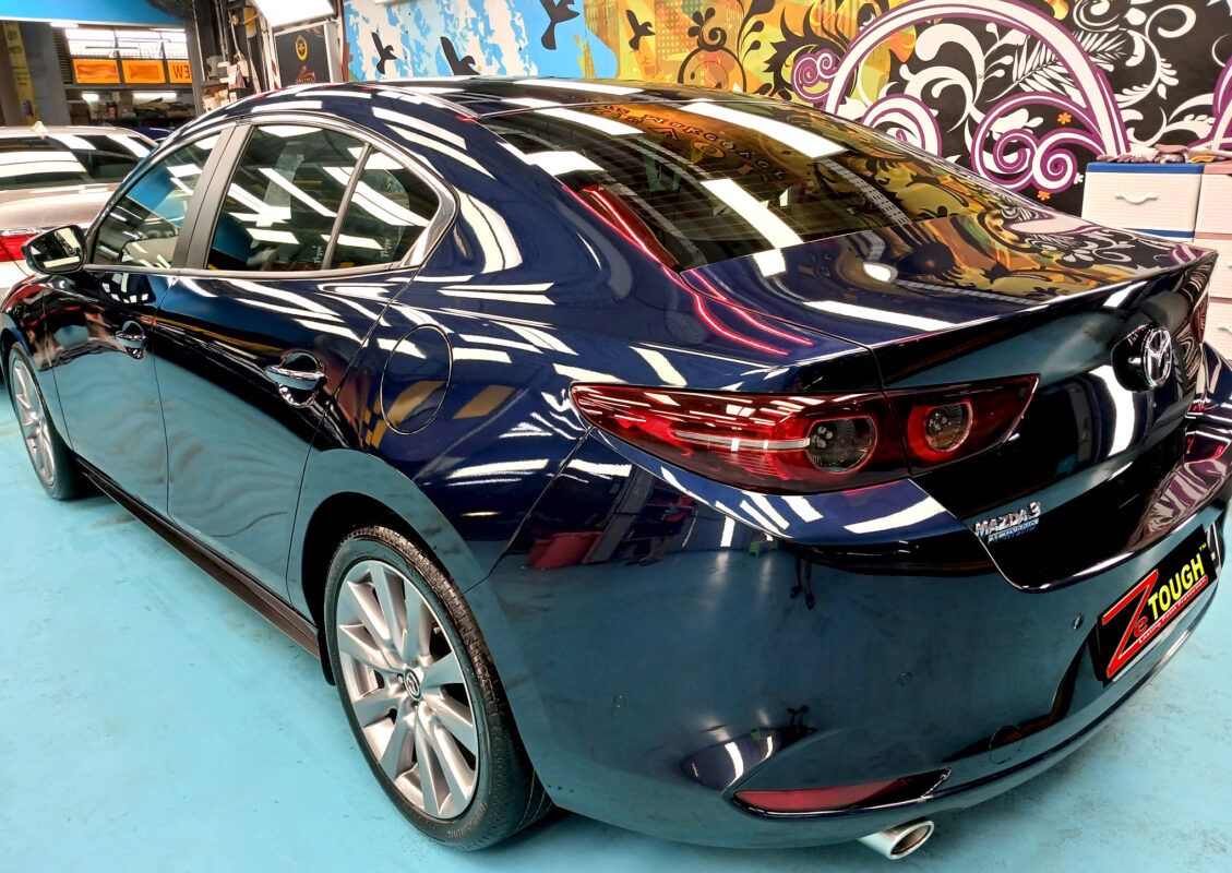 Rear quarter of the Mazda 3, glossy and protected.