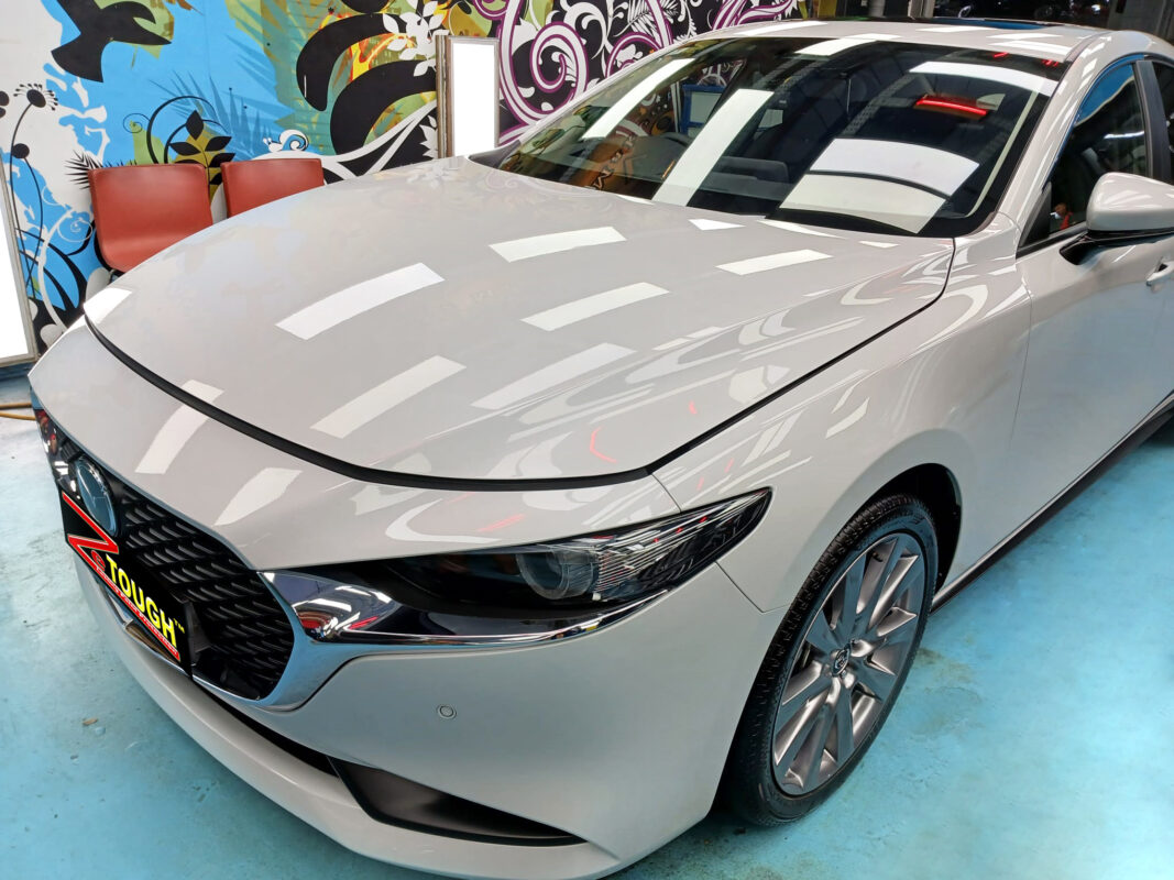 The Mazda 3 from a side angle after the titanium coating.