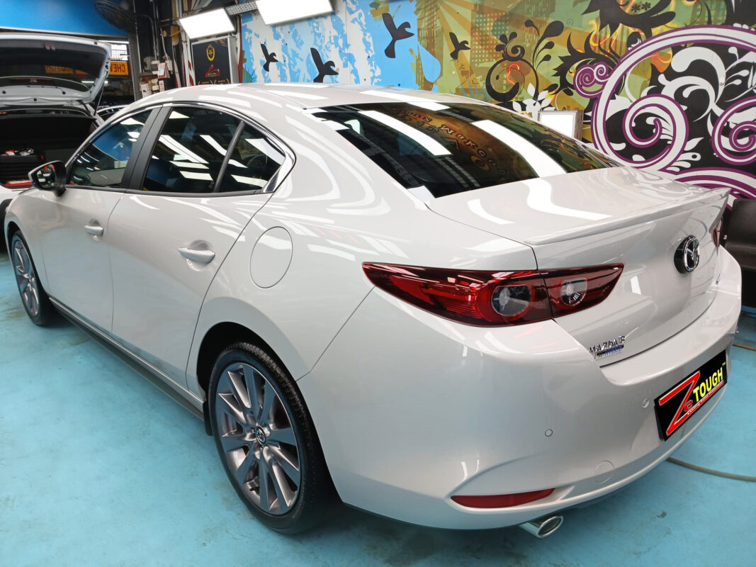 Rear quarter of the Mazda 3, glossy and protected.