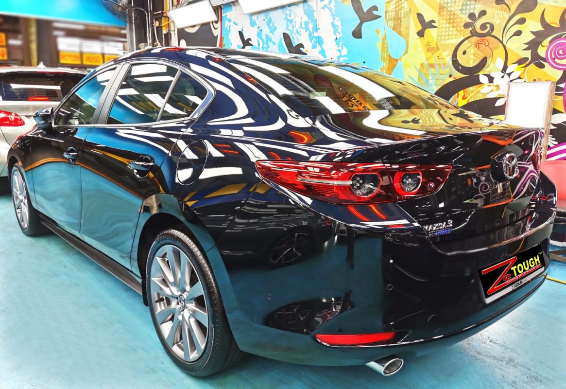 Rear quarter of the Mazda 3, glossy and protected.
