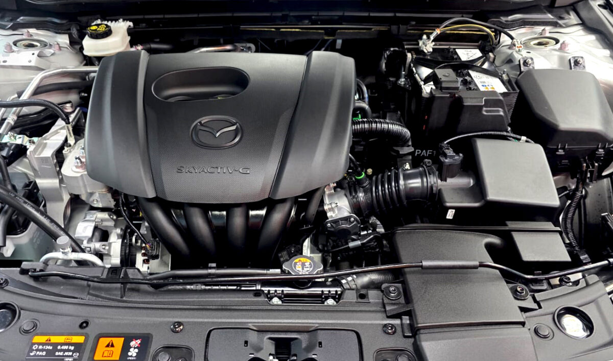 Reflections across the coated panels of the Mazda 3.