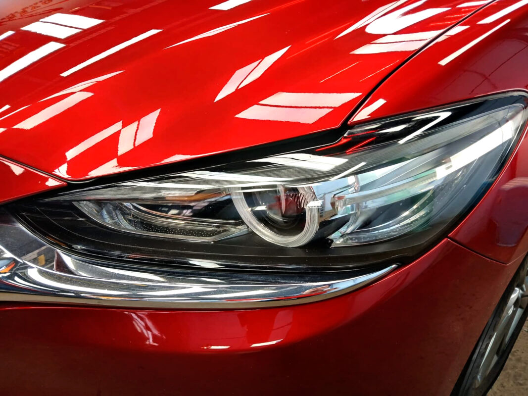 The Mazda 6's coated paintwork showing clean reflections.