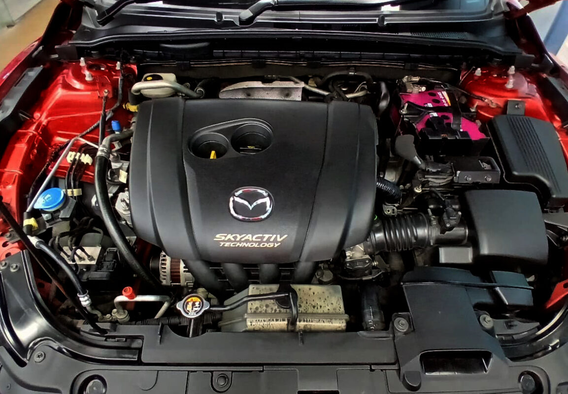 The Mazda 6 parked in the workshop, freshly coated.
