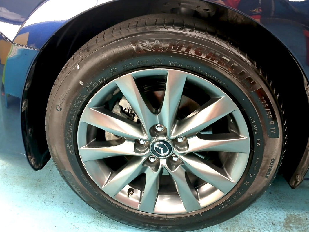 Rear quarter of the Mazda 6, glossy and protected.
