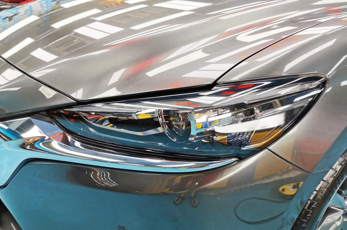 The Mazda 6's coated paintwork showing clean reflections.