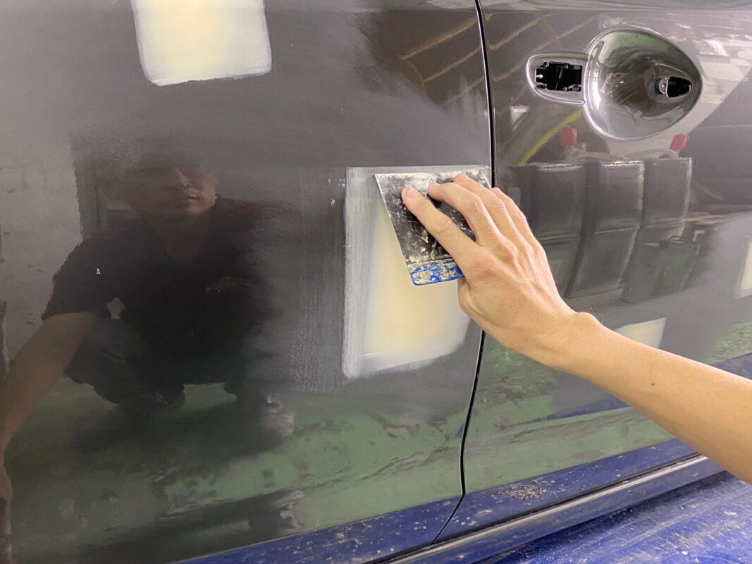Patching and repairing imperfections on the Mazda 6 bodywork.