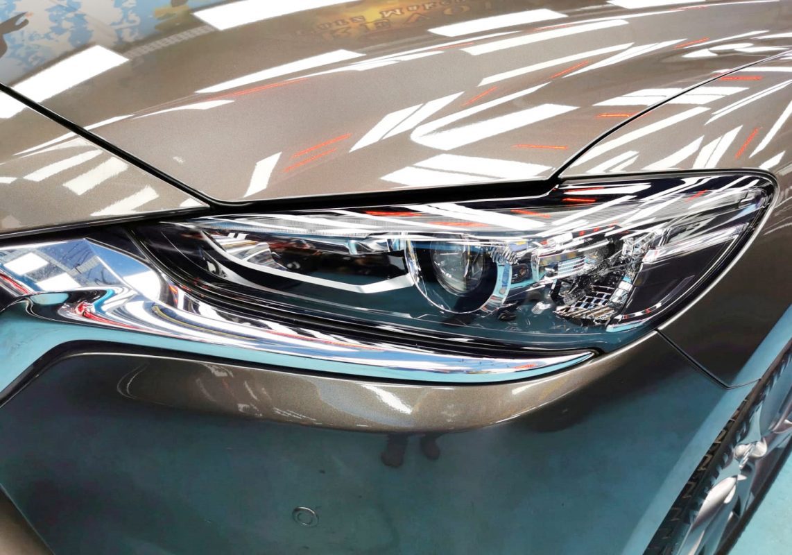 The Mazda 6's coated paintwork showing clean reflections.