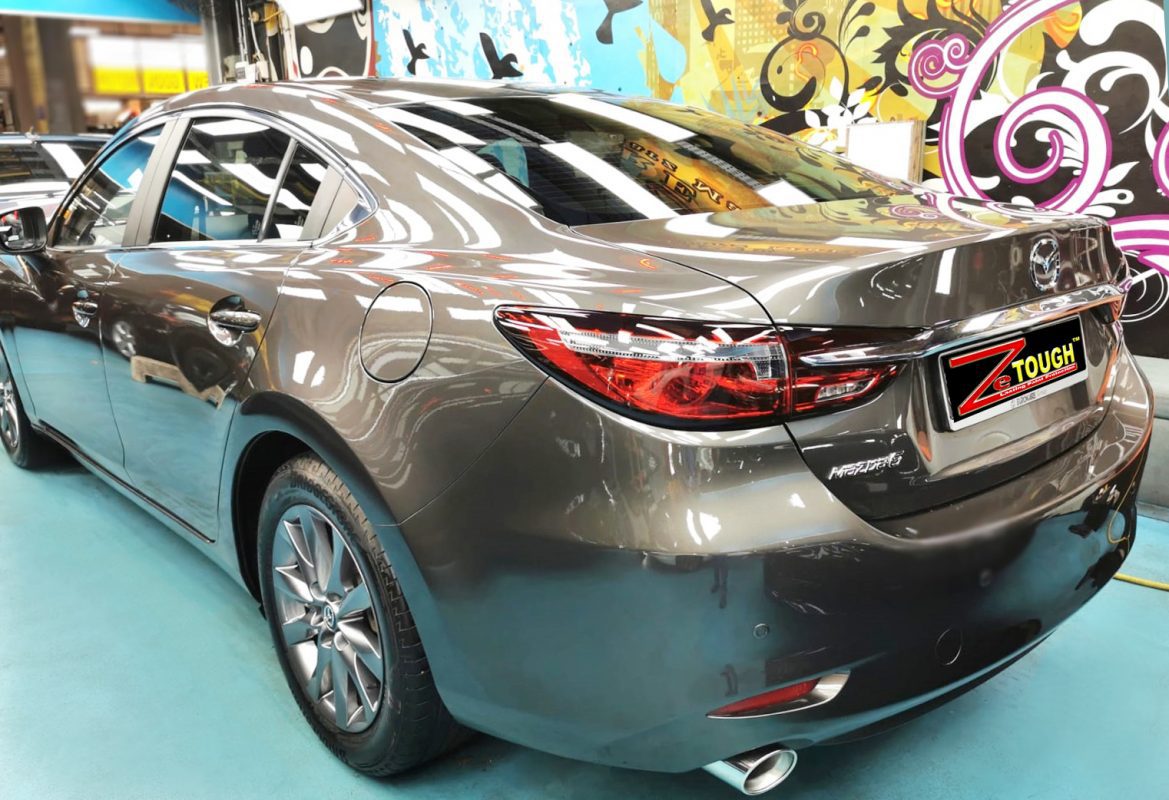 Rear quarter of the Mazda 6, glossy and protected.