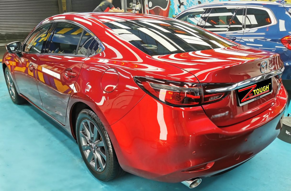 Rear quarter of the Mazda 6, glossy and protected.