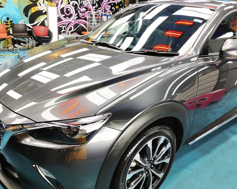 The Mazda CX-3 from a side angle after the ceramic coating.