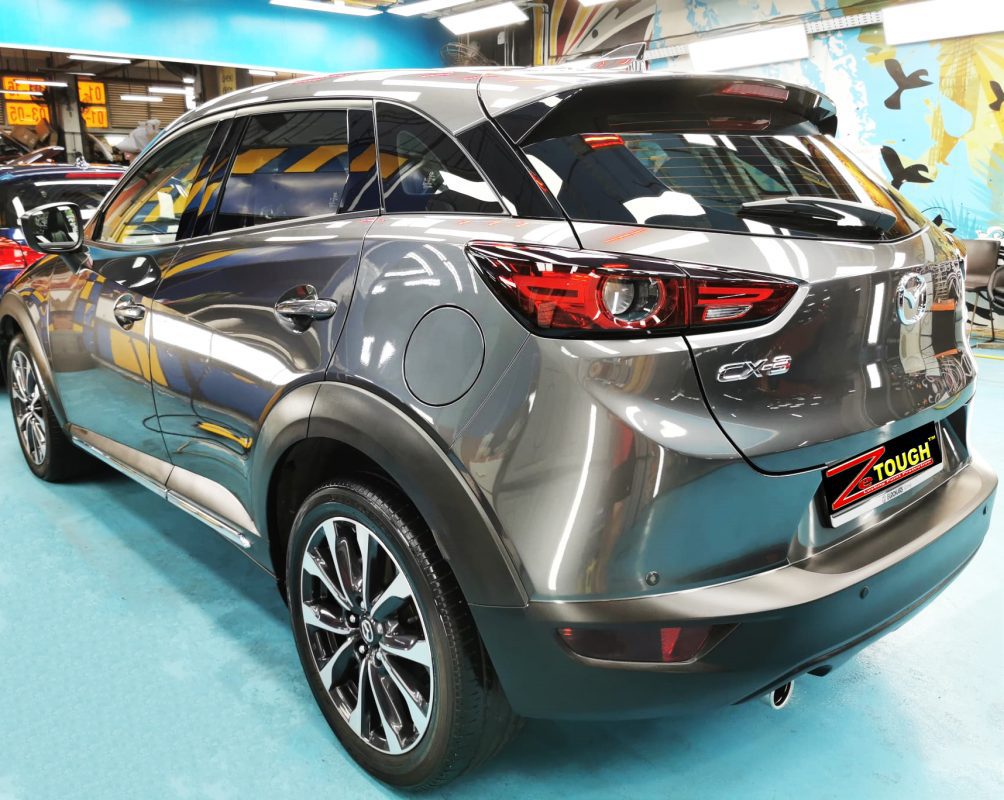 Rear quarter of the CX-3, glossy and protected.