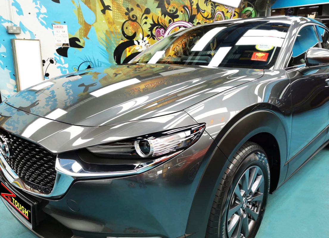 The Mazda CX-30 from a side angle after the ceramic coating.