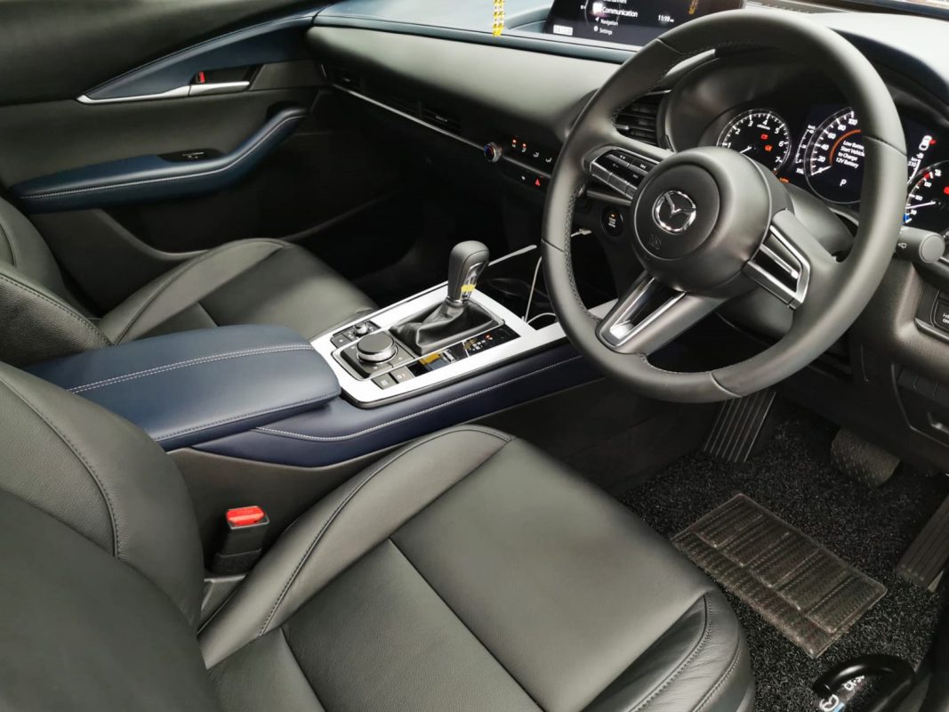 The CX-30 parked in the workshop, freshly coated.
