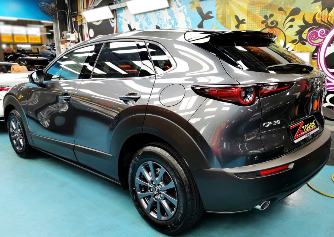 Rear quarter of the CX-30, glossy and protected.