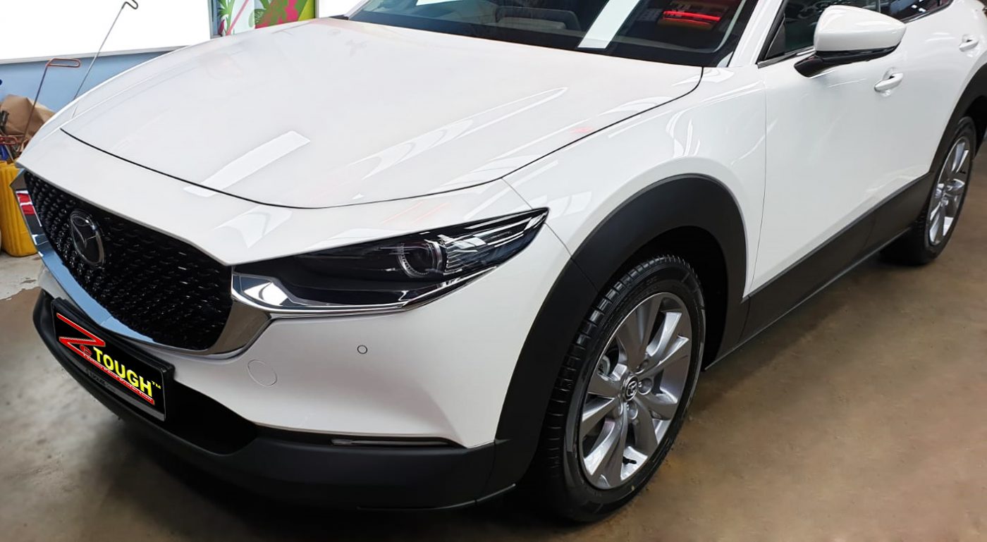 The Mazda CX-30 from a side angle after the titanium coating.