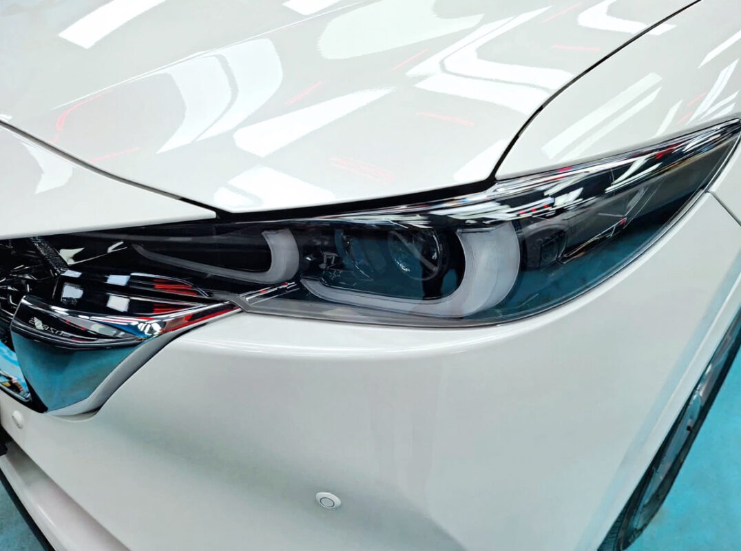 The CX-5's coated paintwork showing clean reflections.