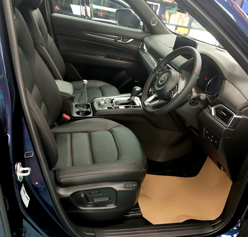 The Mazda CX-5 parked in the workshop, freshly coated.