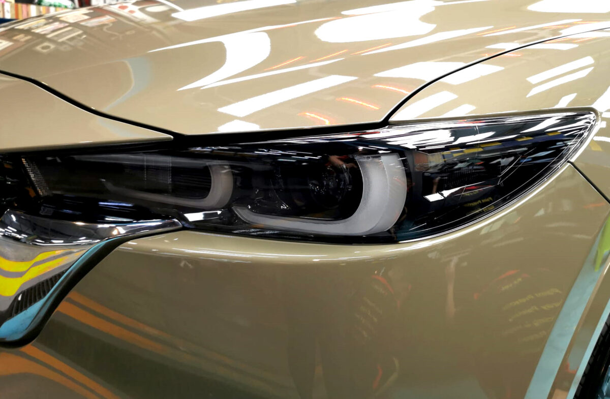 The CX-5's coated paintwork showing clean reflections.