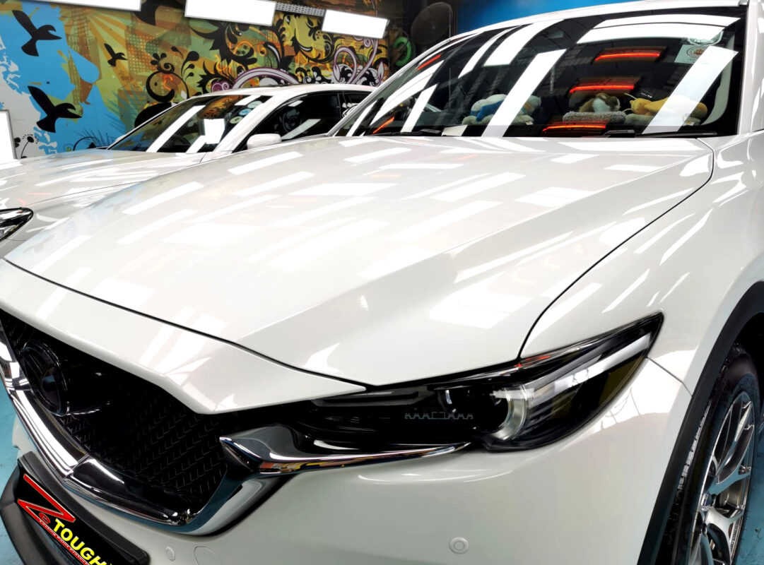 The Mazda CX-5's coated paintwork under workshop lighting.