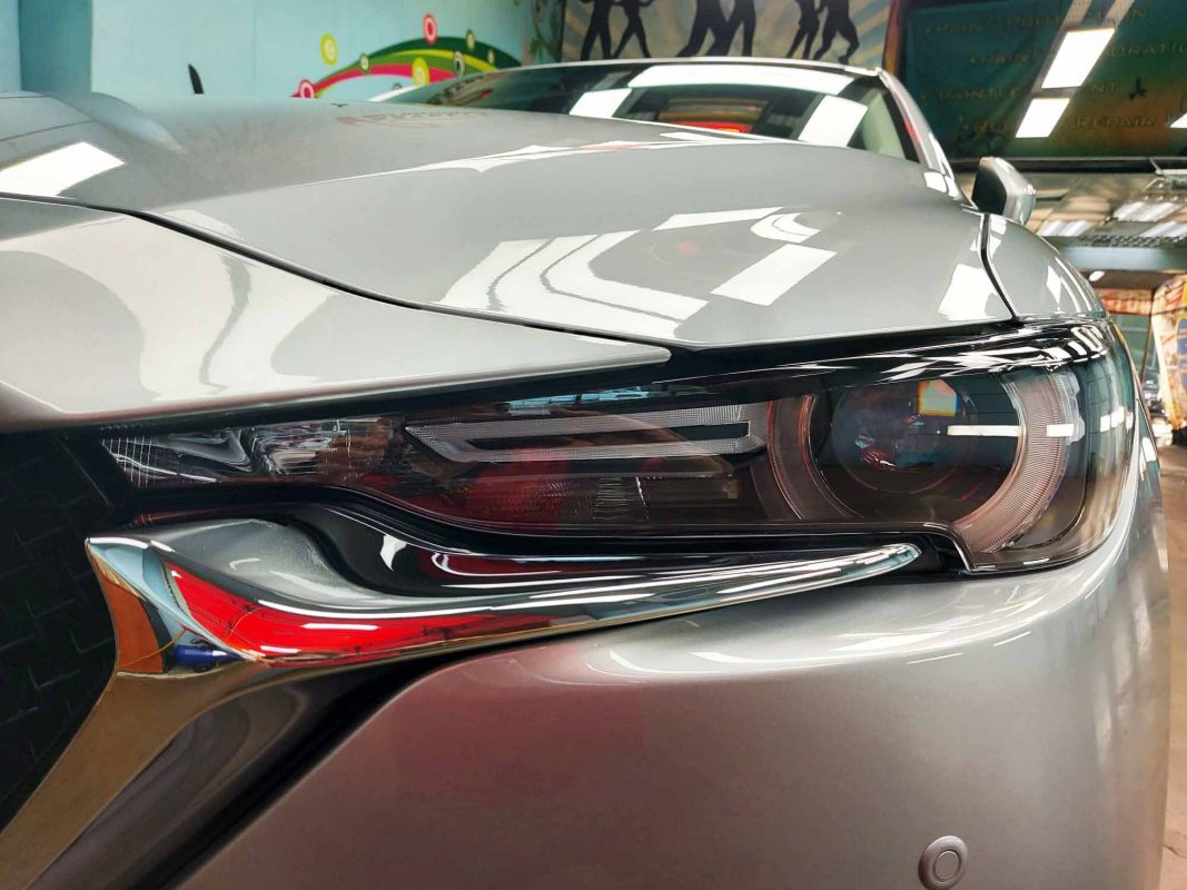The CX-5's coated paintwork showing clean reflections.