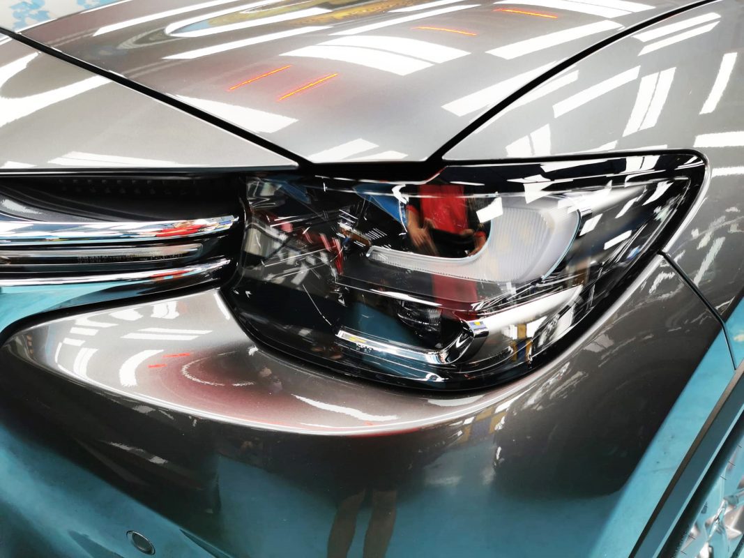 The CX-60's coated paintwork showing clean reflections.