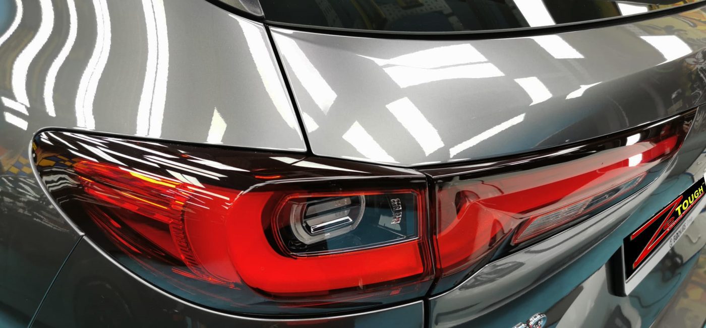 The coated bonnet of the Mazda CX-60 under workshop lighting.